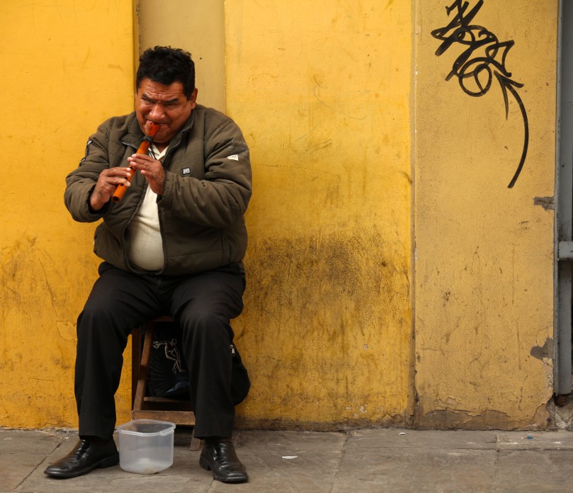 Wood flute street performer